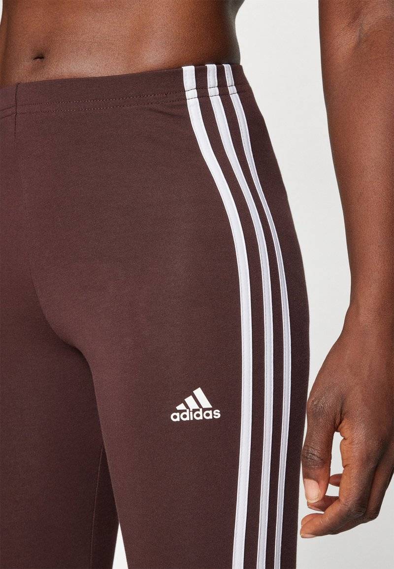 adidas Sportswear adidas Sportswear ESSENTIALS 3 STRIPES HIGH WAISTED - Leggings - shadow brown Lagerräumung