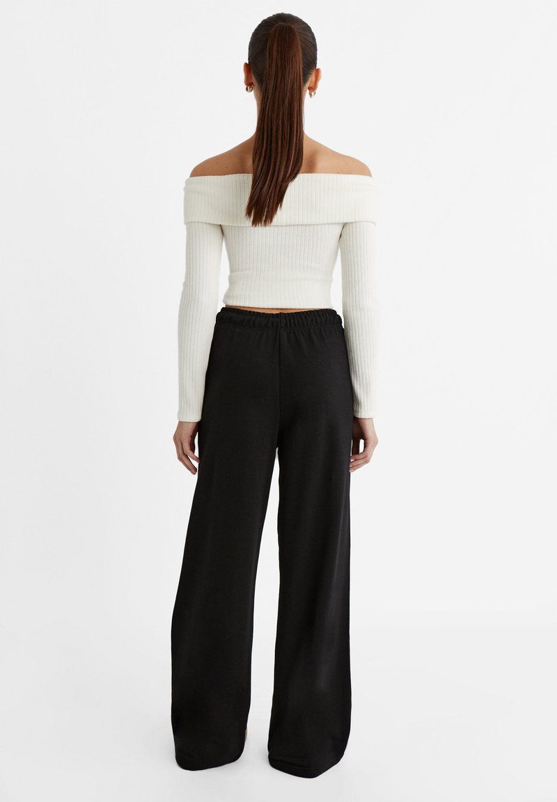 Stradivarius Stradivarius WIDE-LEG JOGGER - Tracksuit bottoms - black Speichern exportieren