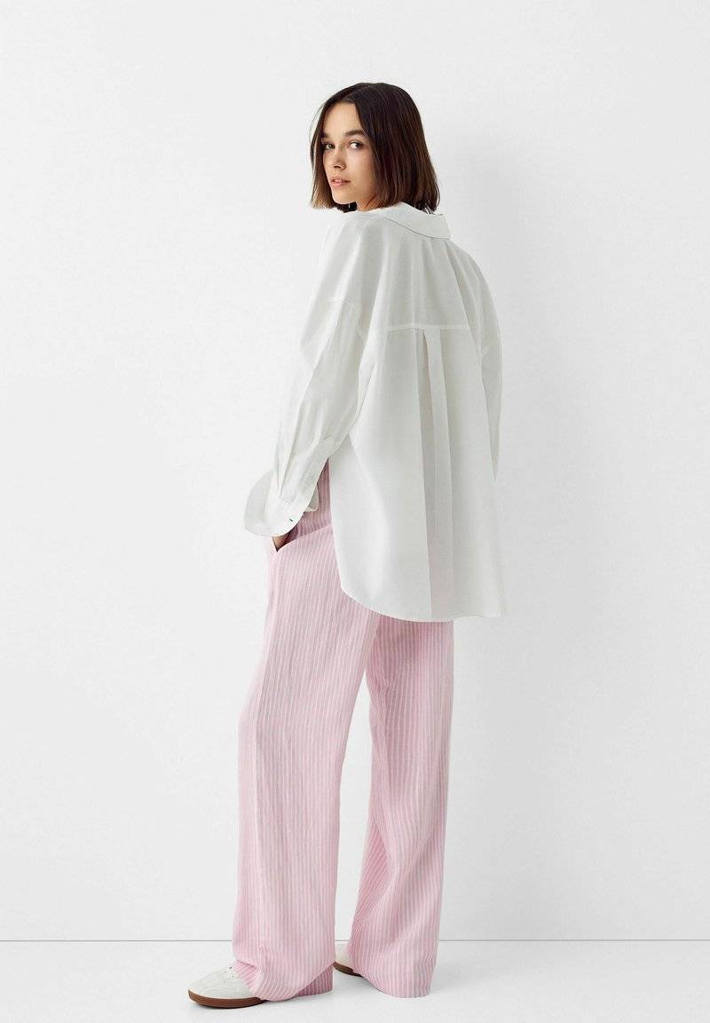 Bershka Bershka WITH AN ELASTIC - Trousers - light pink Kostenloser Versand international