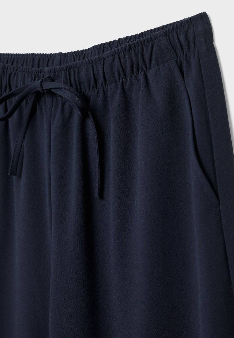 Stradivarius Stradivarius LONG FLOWING - Trousers - mottled dark blue Speichern exportieren