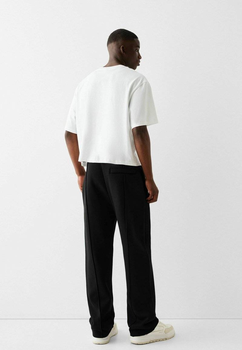 Bershka Bershka WIDE - Tracksuit bottoms - black Im Verkauf