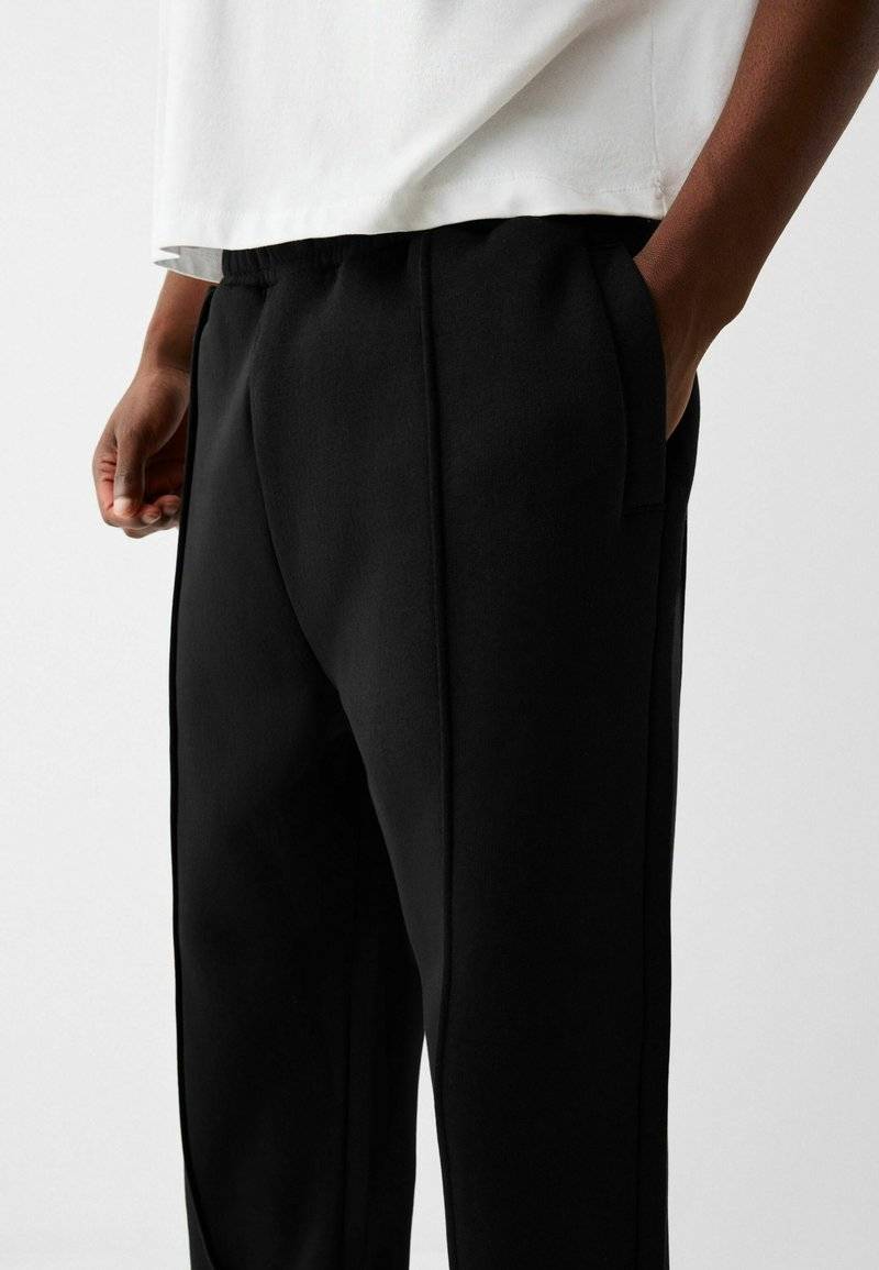 Bershka Bershka WIDE - Tracksuit bottoms - black Im Verkauf