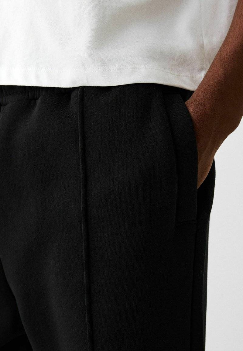 Bershka Bershka WIDE - Tracksuit bottoms - black Im Verkauf