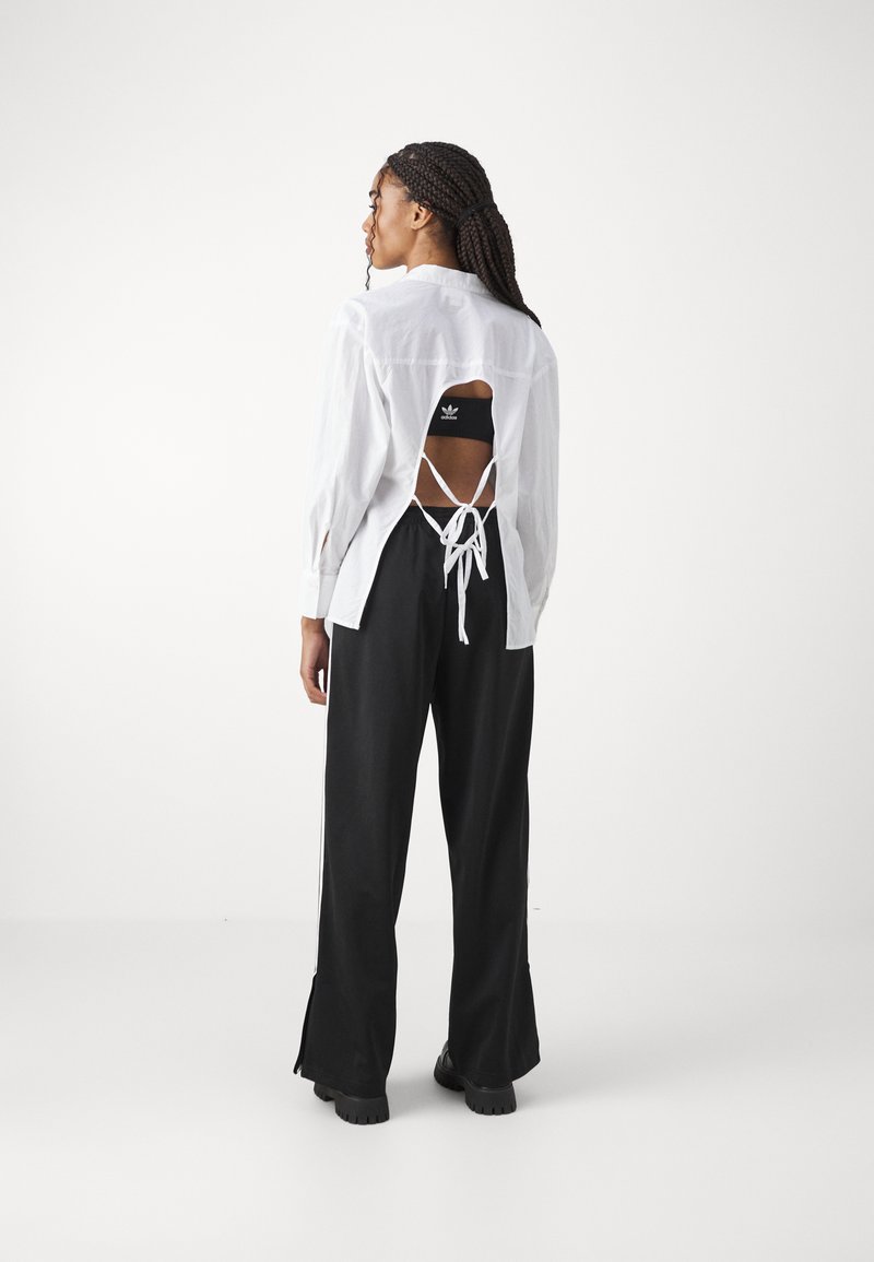 adidas Originals adidas Originals FBIRD LOOSE - Tracksuit bottoms - black Bis zu 65% Rabatt