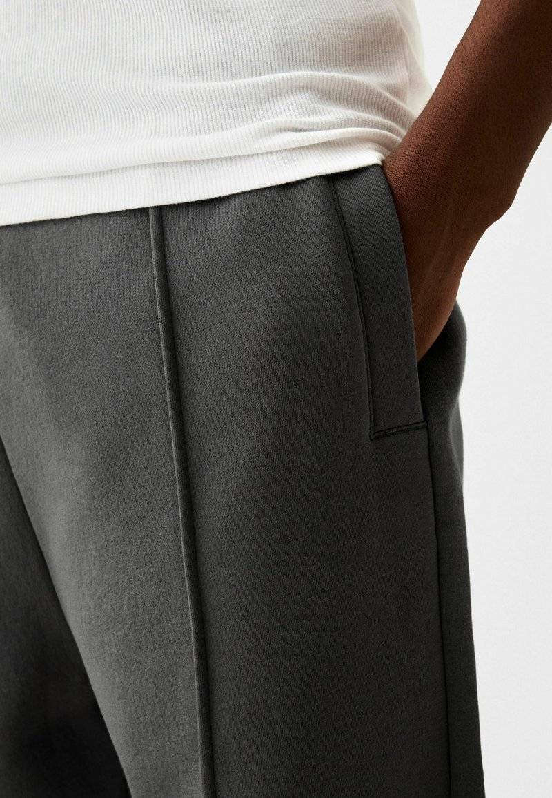 Bershka Bershka WIDE - Tracksuit bottoms - dark grey Riesige Rabatte