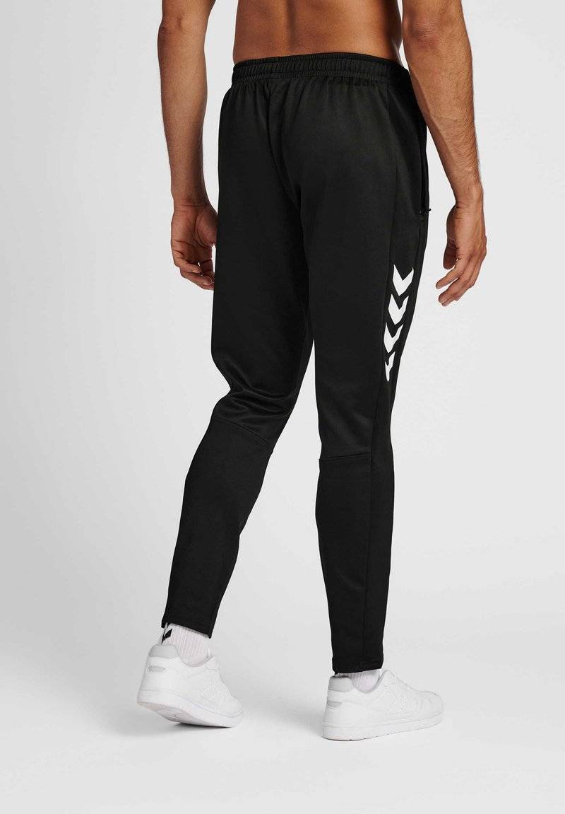 Hummel Hummel CORE XR TRAINING PANTS - Tracksuit bottoms - black Angebote