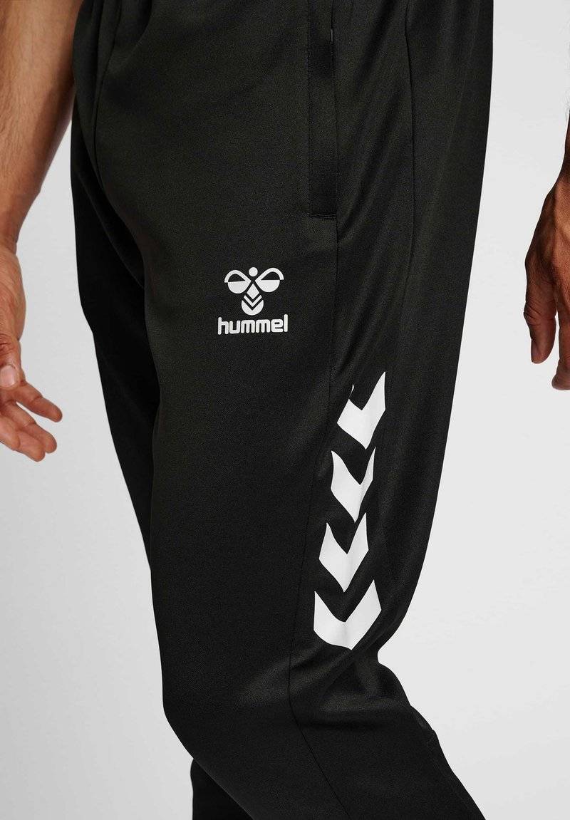 Hummel Hummel CORE XR TRAINING PANTS - Tracksuit bottoms - black Angebote