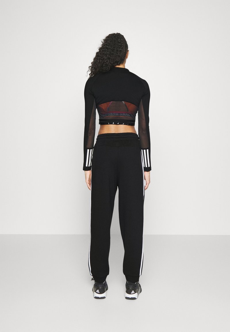 adidas Sportswear adidas Sportswear ESSENTIALS 3-STRIPES LOOSE-FIT - Tracksuit bottoms Sonderangebot