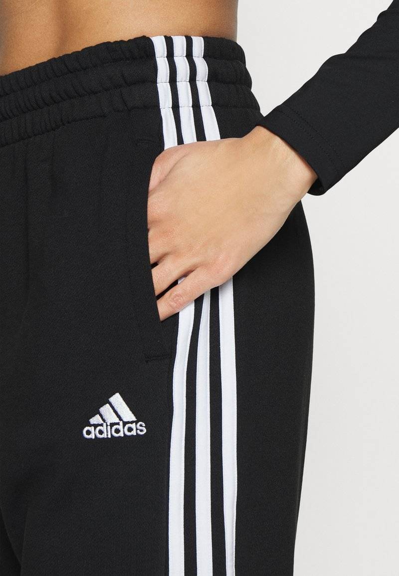 adidas Sportswear adidas Sportswear ESSENTIALS 3-STRIPES LOOSE-FIT - Tracksuit bottoms Sonderangebot