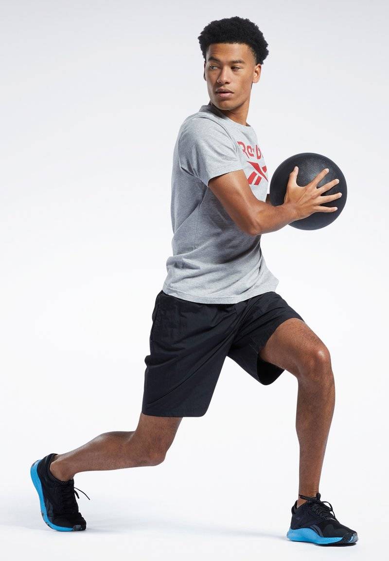 Reebok Reebok ID TRAIN UTILITY - Sports shorts - black Rabatt