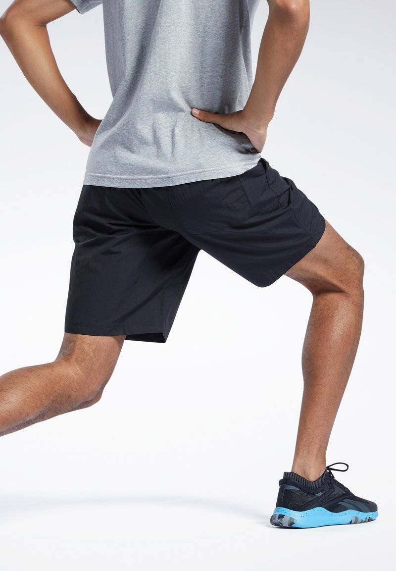 Reebok Reebok ID TRAIN UTILITY - Sports shorts - black Rabatt