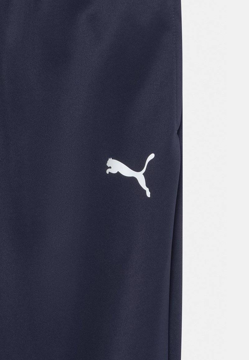 Puma Puma TEAMRISE POLY TRAINING UNISEX - Tracksuit bottoms 50% Rabatt für begrenzte Zeit