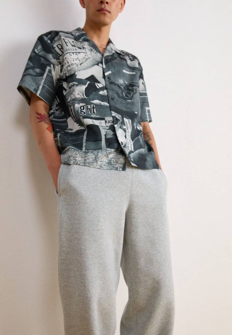 Nike Sportswear Nike Sportswear BUNGIE PANT - Tracksuit bottoms - grey heather Online Outlet