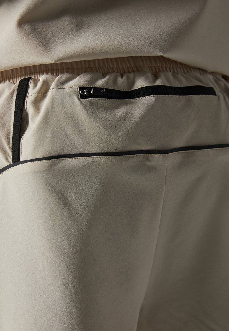 Pier One Sport Pier One Sport Sports shorts - beige Speichern exportieren