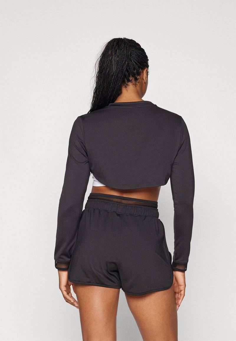 Puma Puma PAMELA REIF CROPPED - Long sleeved top - black zollfrei