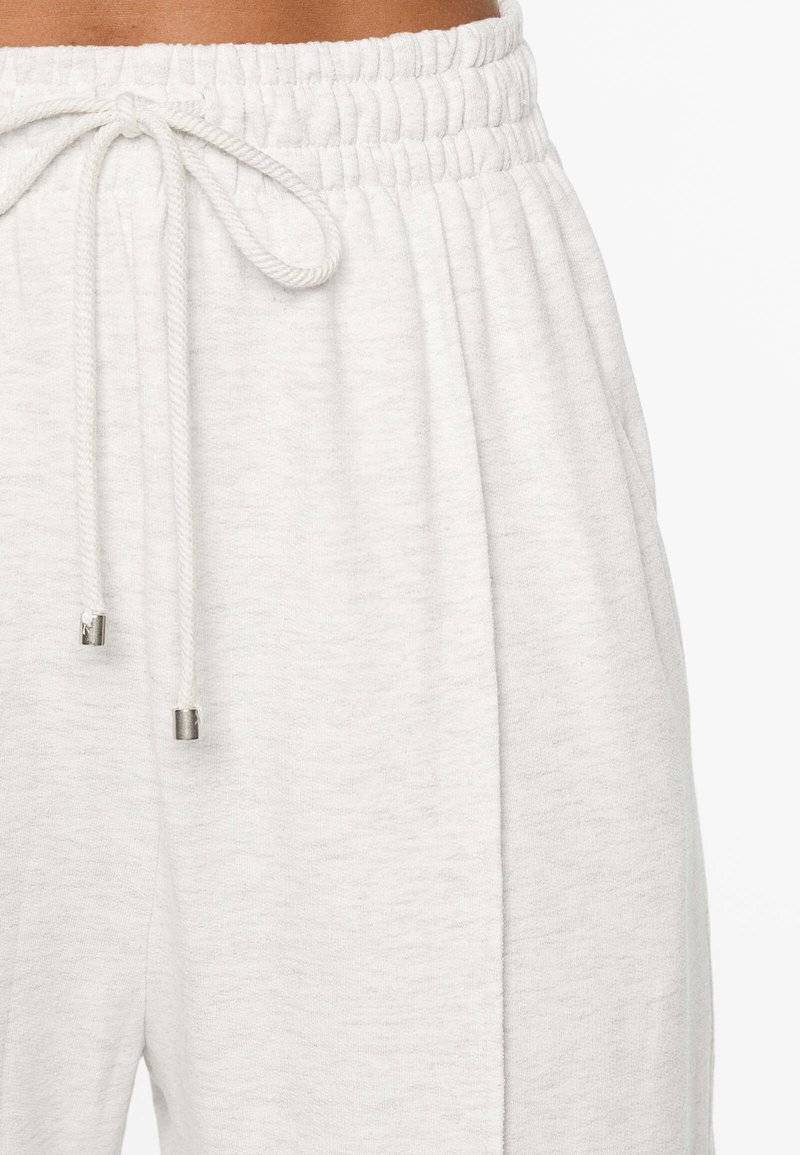 OYSHO OYSHO SOFT TOUCH RELAXED STRAIGHT-LEG - Tracksuit bottoms - mottled light grey Bestseller