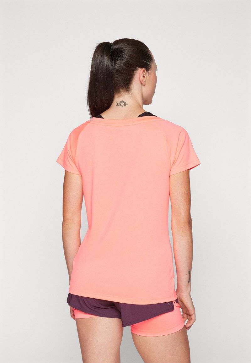 Puma Puma TRAIN FAVORITE CAT TEE - Sports T-shirt - sunset glow Neueste Mode