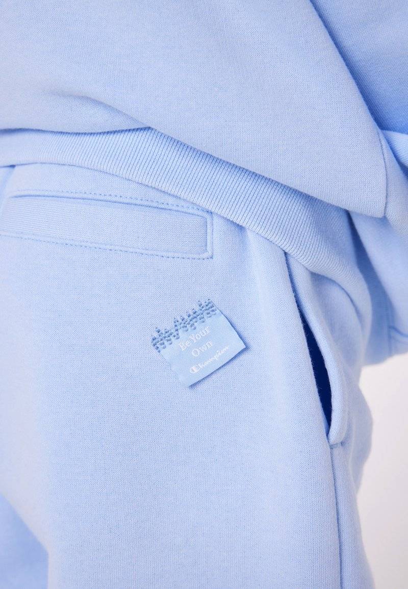 Champion Champion EXCLUSIVE PANT UNISEX - Tracksuit bottoms - light blue Jubiläumsangebot