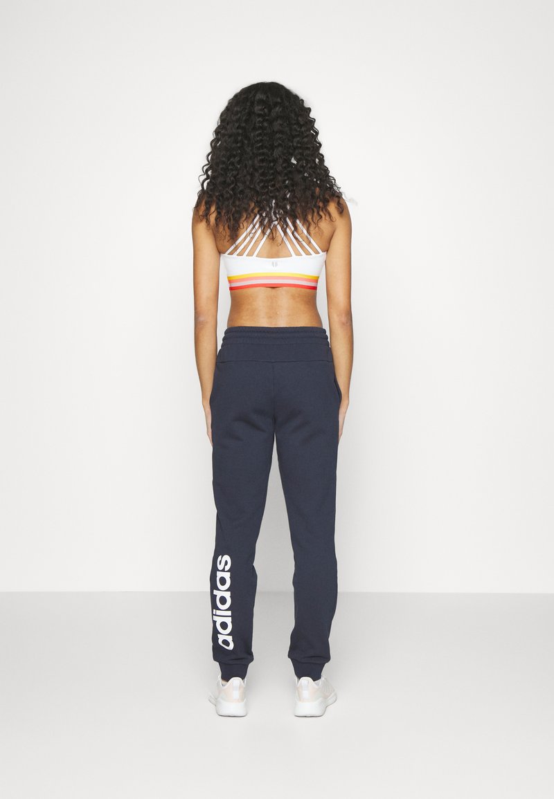 adidas Sportswear adidas Sportswear ESSENTIALS LINEAR CUFFED - Tracksuit bottoms - legend ink Super Sparpreis