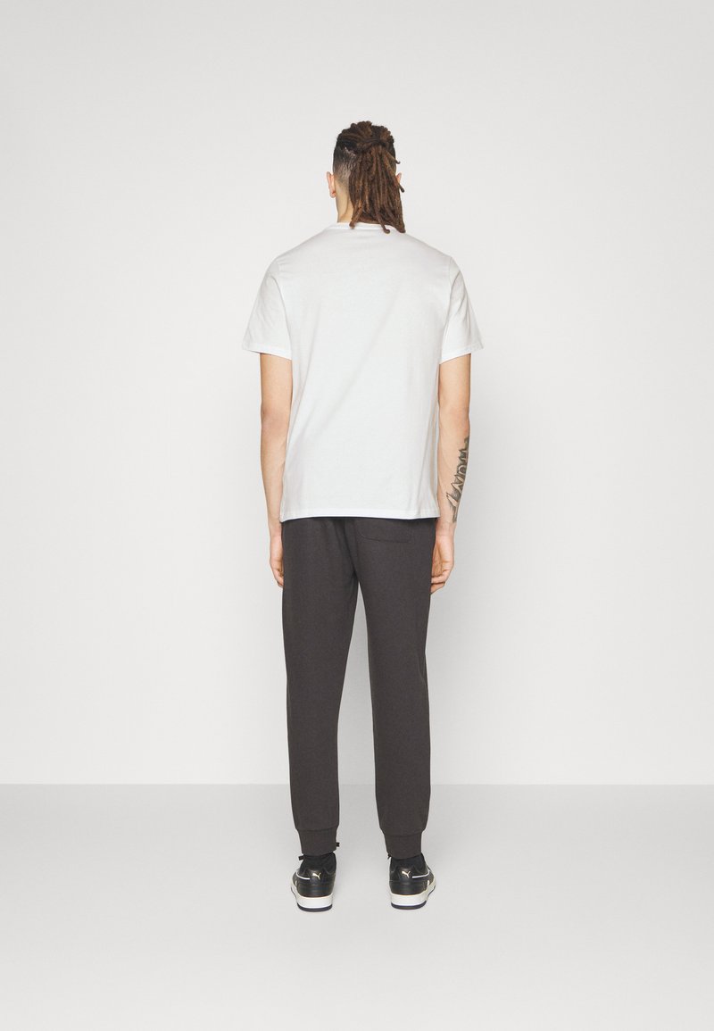 Converse Converse GO TO STAR CHEVRON TEE UNISEX - Print T-shirt - white Bis zu 60% Rabatt