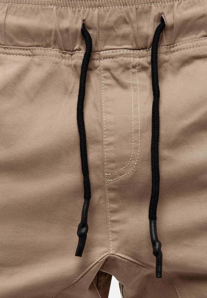 Tazzio Tazzio Cargo trousers - beige Zeitbegrenzte Promotion