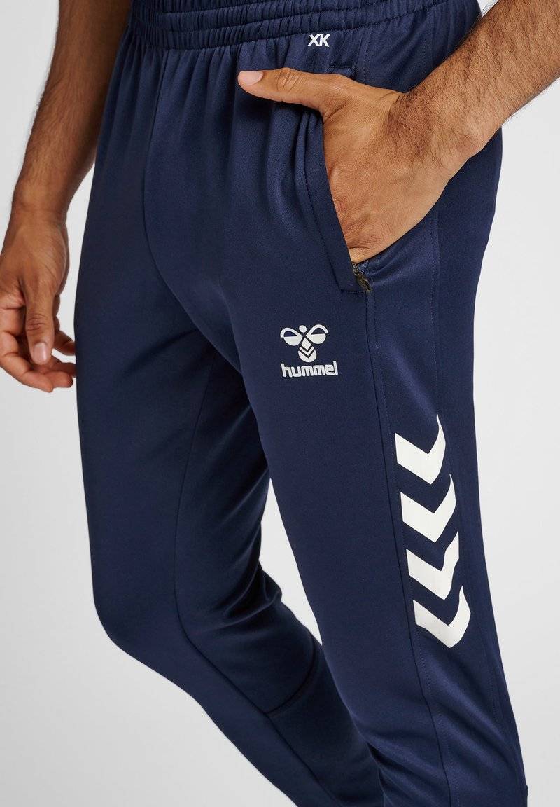 Hummel Hummel CORE XR TRAINING PANTS - Tracksuit bottoms - marine Verkauf